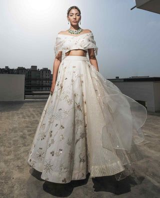 White multi-layered lehenga and blouse