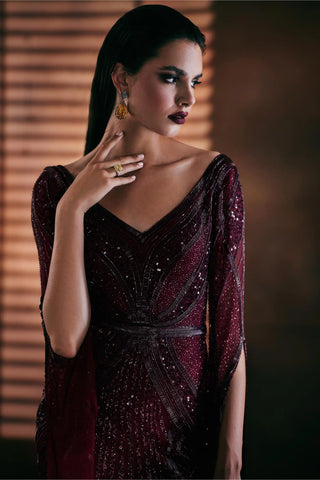 Burgundy embroidered gown with floor-length sleeves