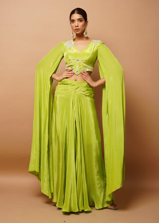 Bright green bustier and slit draped skirt