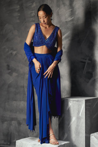 Blue rainfall drape reim skirt with low v cut blouse and dupatta