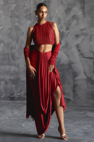 Red fitted broad pleat reim skirt with backless embellished blouse