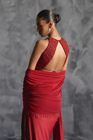 Red fitted broad pleat reim skirt with backless embellished blouse