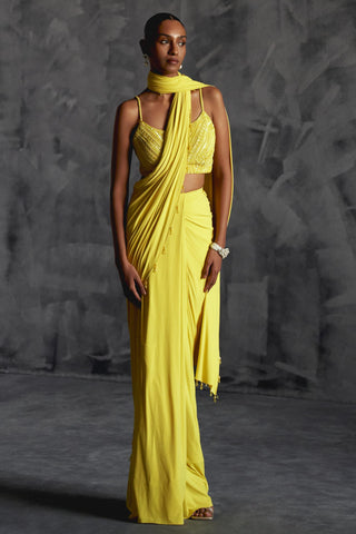 Yellow fitted draped reim saree with strappy embellished blouse