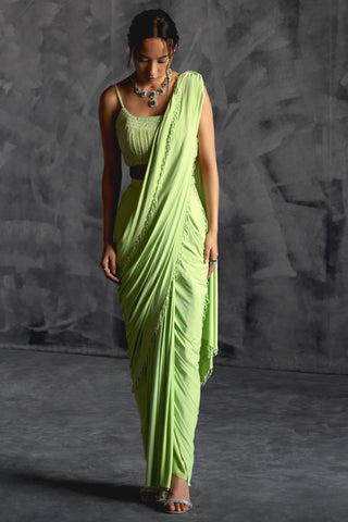 Green high slit reim saree with strappy blouse