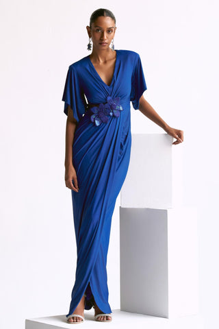 Blue draped power shoulder reim gown