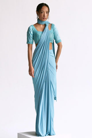 Blue draped reim saree with elbow sleeve blouse