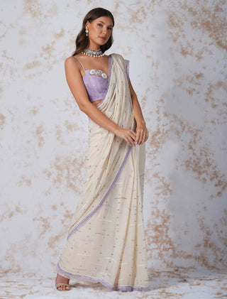 Sequined deep ivory saree and contrast blouse