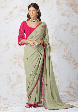 Beaded flower green saree and pink blouse