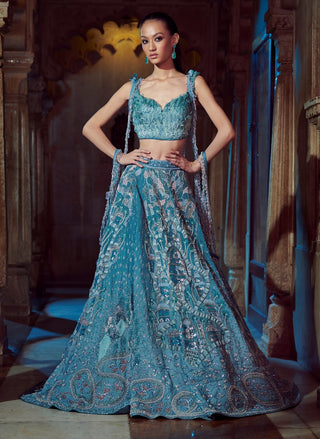 Blue silk lehenga and feather blouse