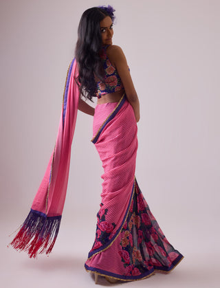 Pink georgette striped and rose printed saree with fringes detail paired with emb floral blouse