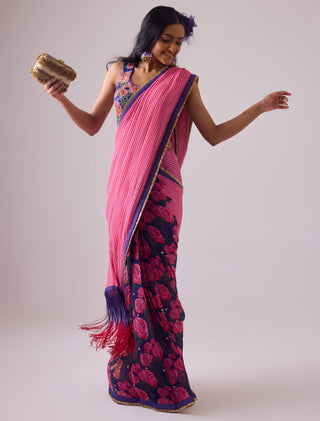 Pink georgette striped and rose printed saree with fringes detail paired with emb floral blouse