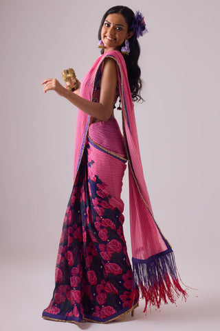 Pink georgette striped and rose printed saree with fringes detail paired with emb floral blouse