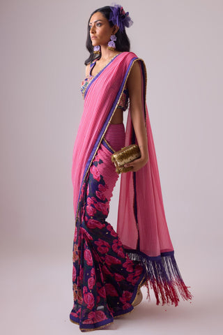 Pink georgette striped and rose printed saree with fringes detail paired with emb floral blouse