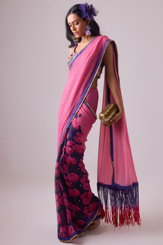 Pink georgette striped and rose printed saree with fringes detail paired with emb floral blouse