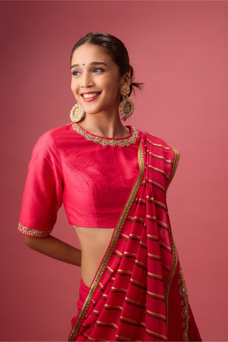 Pink double layer lehenga paired with blouse and dupatta