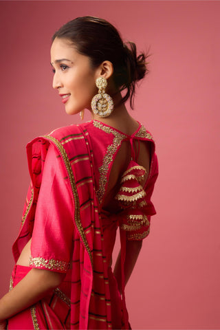 Pink double layer lehenga paired with blouse and dupatta