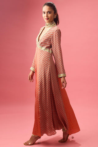 Orange kalidar kurta with print and embroidery paired with churidar