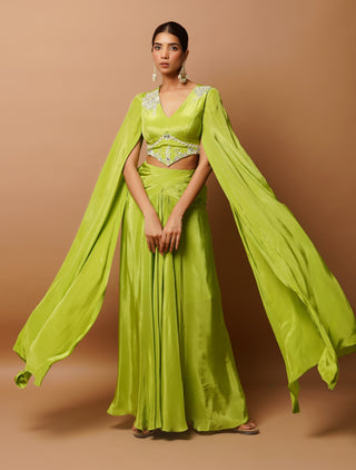 Bright green bustier and slit draped skirt