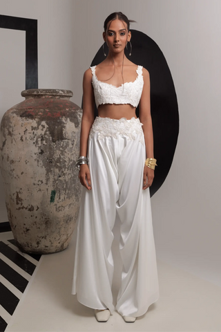 Ivory sleeveless bustier with high low pants