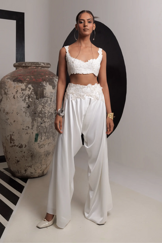 Ivory sleeveless bustier with high low pants