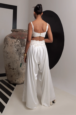 Ivory sleeveless bustier with high low pants