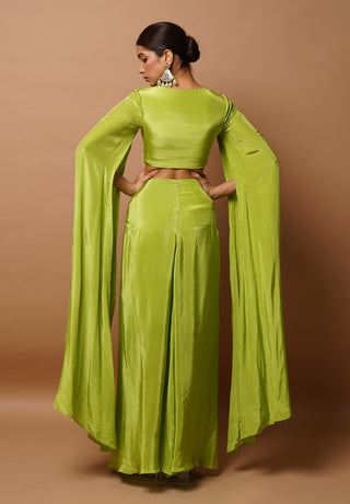 Bright green bustier and slit draped skirt