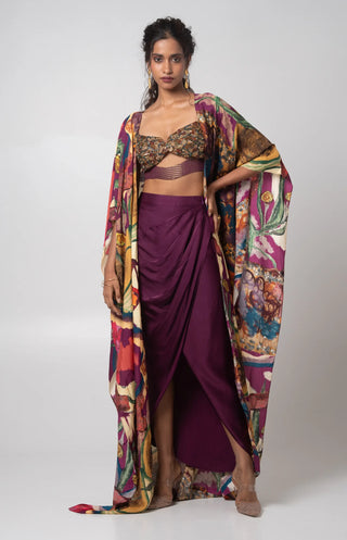 Purple hand embroidered bustier with printed cape and a draped skirt