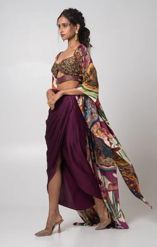 Purple hand embroidered bustier with printed cape and a draped skirt