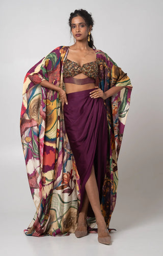 Purple hand embroidered bustier with printed cape and a draped skirt