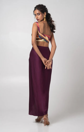 Purple hand embroidered bustier with printed cape and a draped skirt