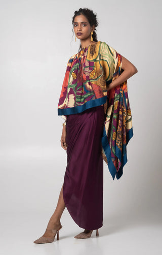 Deep purple free size poncho paired with a draped skirt