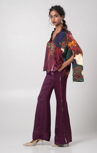 Purple V-neck top paired with a solid flared trouser