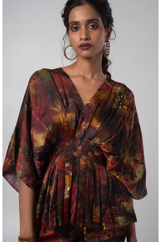 Multicolored V-neck kimono top paired with flared trouser