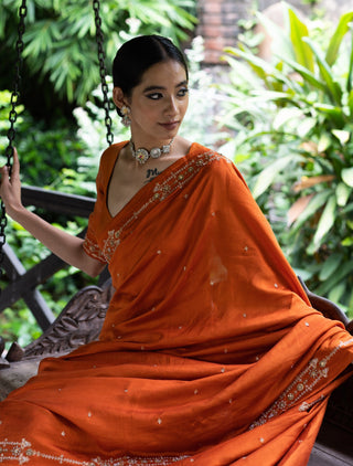 Rust orange embroidered silk saree and blouse