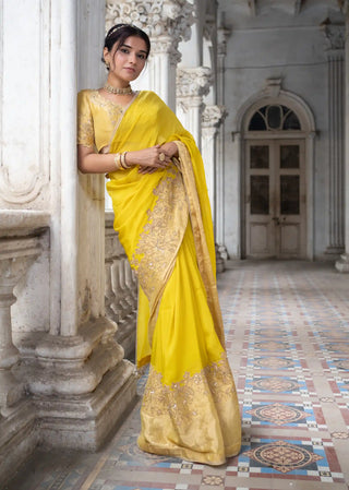 Gold embroidered blouse and acaia green saree