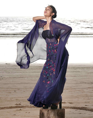 Blue embroidered gown and cape