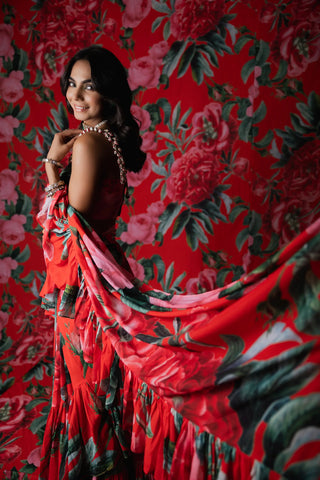 Red floral printed ruffle saree with a blouse