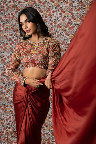 Maroon draped saree paired with printed top