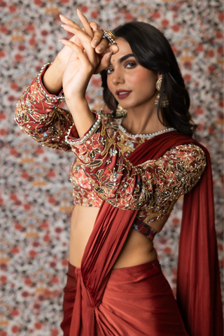 Maroon draped saree paired with printed top