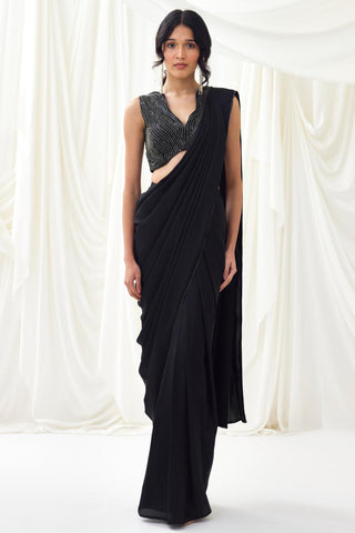 Black pre-draped saree with statement wave blouse