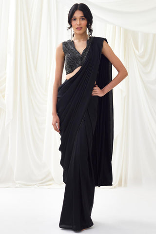 Black pre-draped saree with statement wave blouse