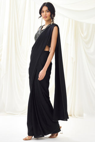 Black pre-draped saree with statement wave blouse