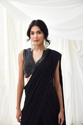 Black pre-draped saree with statement wave blouse