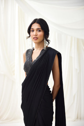 Black pre-draped saree with statement wave blouse