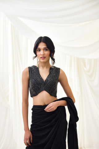 Black pre-draped saree with statement wave blouse