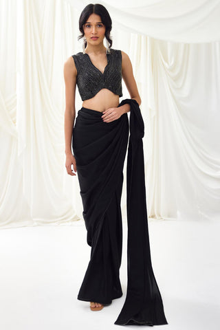 Black pre-draped saree with statement wave blouse