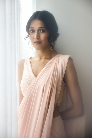 Blush pre-draped saree with sequin blouse and crystal edging