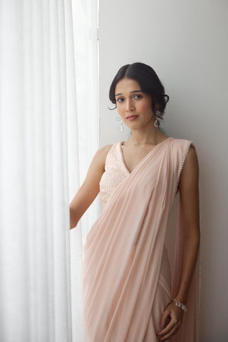 Blush pre-draped saree with sequin blouse and crystal edging