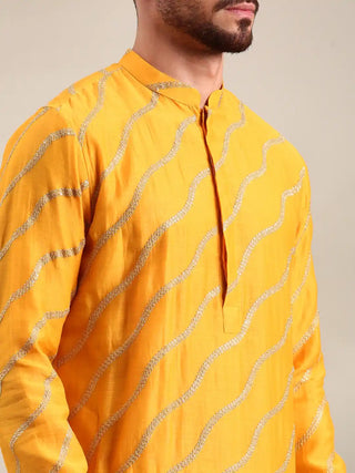 Yellow embroidered chanderi kurta and churidar