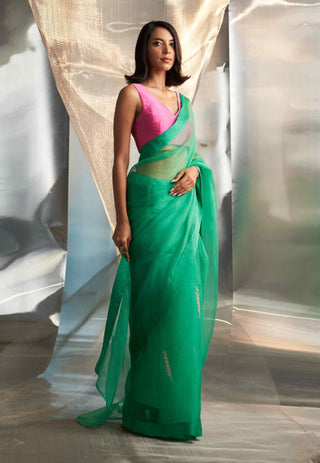 Lush green saree with pink blouse